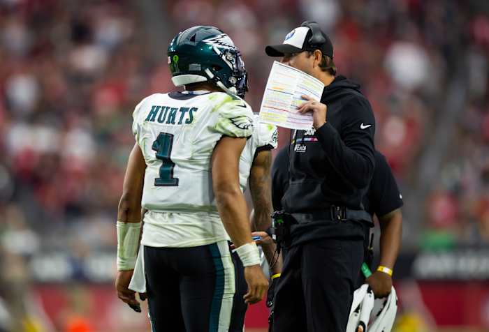 Oct 9, 2022; Glendale, Arizona, USA; Philadelphia Eagles quarterback Jalen Hurts (1) talks with offensive coordinator Shane Steichen against the Arizona Cardinals at State Farm Stadium. Mandatory Credit: Mark J. Rebilas-USA TODAY Sports